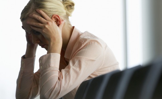 Stressed Businesswoman --- Image by © Royalty-Free/Corbis